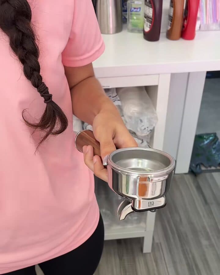Pulling an espresso shot behind the counter